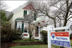  ?? AP/STEVEN SENNE ?? A home in Natick, Mass., waits for a buyer. Americans purchased homes in March at the fastest pace in more than a decade.