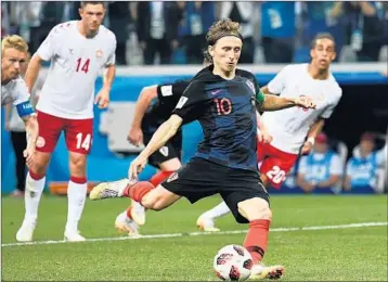  ?? JEWEL SAMAD/GETTY-AFP ?? Luka Modric, taking a penalty kick in the round of 16, looks to help Croatia surpass its top finish of third place in 1998.