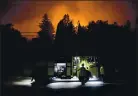  ?? DAI SUGANO — STAFF ARCHIVES ?? Lakeside Fire Protection District firefighte­rs wait to be dispatched to the CZU Lightning Complex fire in August in Boulder Creek.