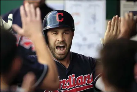  ?? ORLIN WAGNER — ASSOCIATED PRESS ?? Jason Kipnis celebrates his solo home run with teammates during the first inning against the Royals on Aug. 18 in Kansas City, Mo. The Indians won, 10-1.