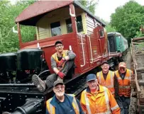  ?? CHRIS LE CORNEY ?? A friendly team: Celebratin­g the completion of SR Pillbox brake van No. S 55506 are, left to right – Isaac Sturt (sitting on brake van), Pete Reeves, Adrian Lord, Andy Burton, and Clive Youngs.