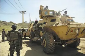  ?? Rahmat Gul / Associated Press ?? Afghan forces guard the site of a suicide bombing attack Wednesday near Kabul. The U.S. is no longer disclosing informatio­n on insurgent attacks.