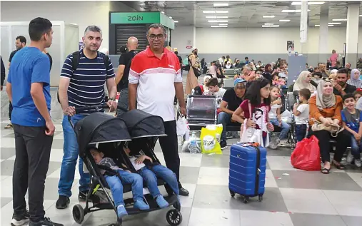  ?? File/AFP ?? Passengers sit in a waiting room on the Jordanian side of the Allenby Bridge crossing between the West Bank and Jordan.