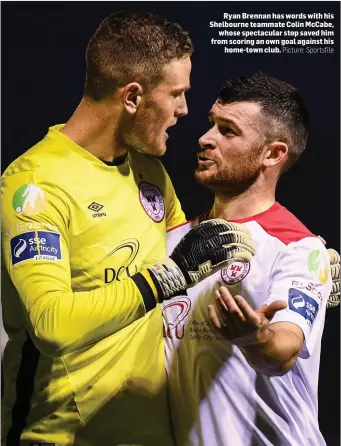  ?? Picture: Sportsfile ?? Ryan Brennan has words with his Shelbourne teammate Colin McCabe, whose spectacula­r stop saved him from scoring an own goal against his home-town club.