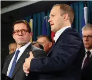  ?? ADRIAN WYLD / THE CANADIAN PRESS ?? MP Bob Zimmer, chair of the House of Commons privacy committee, left, listens to deputy chair Nathaniel Erskine-smith. Zimmer says he’s impressed with how Estonia preserves the sanctity of personal data.