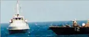  ?? U.S. NAVY ?? An Iranian vessel, left, is seen Tuesday near the USS Thunderbol­t, a Navy patrol ship, in the Persian Gulf.