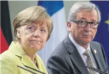  ??  ?? Angela Merkel and EU Commission president Juncker