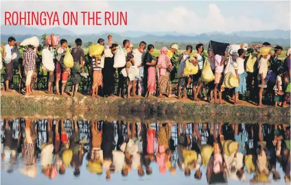  ?? Picture:Reuters ?? Rohingya refugees who have fled from Myanmar wait to be let through the Bangladesh border after crossing at Palang Khali yesterday.