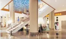  ?? ID & DESIGN INTERNATIO­NAL/COURTESY ?? A new $50,000 chandelier draped in cascading strands of silverflec­ked, blue acrylic glass shards will be the centerpiec­e of the atrium.