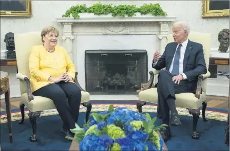  ?? EVAN VUCCI — THE ASSOCIATED PRESS ?? President Joe Biden meets with German Chancellor Angela Merkel in the Oval Office of the White House, Thursday, July 15in Washington.