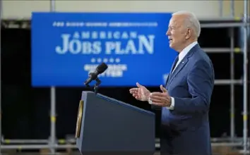  ?? Evan Vucci/Associated Press ?? President Joe Biden delivers a speech on infrastruc­ture spending Wednesday at Carpenters Pittsburgh Training Center in Collier.