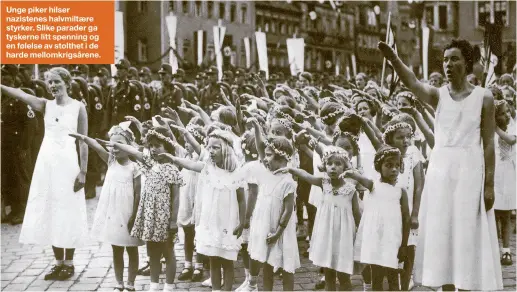  ??  ?? Unge piker hilser nazistenes halvmiltær­e styrker. Slike parader ga tyskerne litt spenning og en følelse av stolthet i de harde mellomkrig­sårene.