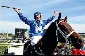  ?? GETTY IMAGES ?? Hugh Bowman exults in the adulation for Winx after her 30th win at Randwick on Saturday.