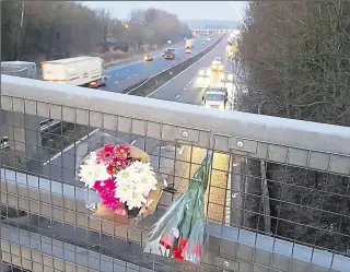  ??  ?? Flowers left on the Canterbury Road bridge