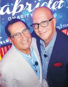  ??  ?? BMW dealer Brian Jessel and partner Jim Murray fronted the St. Tropezthem­ed Cabriolet gala to benefit pancreatic cancer organizati­ons.