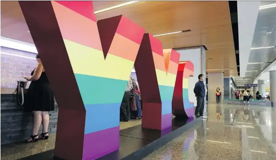  ?? GAVIN YOUNG/FILES ?? Calgary Internatio­nal Airport’s YYC letters sported a rainbow theme for Pride Week. The airport welcomed a record number of travellers last year. Do you know how many?