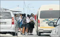  ?? Picture: JUDY DE VEGA ?? STILL OPEN: EduPlanet pupils board a taxi after attending classes