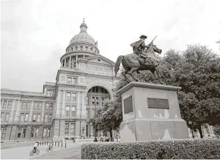  ?? Houston Chronicle file ?? Terry’s Texas Rangers is one statue honoring Confederat­e defenders in the Civil War on the Texas State Capitol Grounds in Austin. The bronze statue portrays one of Terry’s Texas Rangers, who were mustered in 1861 at Houston after Benjamin Terry and...