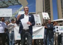  ?? ANDREW FRANCIS WALLACE/TORONTO STAR ?? Ian Black, Uber Toronto’s general manager, attends a rally in support of the ride-booking service at city hall in early May.