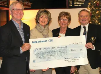  ??  ?? Berna Carthy, xhairperso­n of East Meath Meals onWheels, is presented with a cheque for €700 in support of the services provided by the organisati­on by Paul Brassil, Chairman Drogheda Credit Union and Laytown & Bettystown Golf Club Captains Rita...