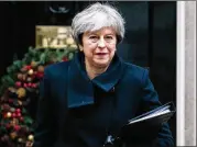  ?? JACK TAYLOR / GETTY IMAGES ?? British Prime Minister Theresa May told the House of Commons on Monday that Britain will be able to leave the European Union “in a smooth and orderly way” after an accord Friday with EU leaders.