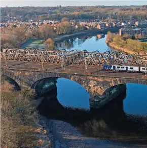  ?? ?? Having just left Preston, Northern 150104 heads south across the River Ribble on January 20 with the 1057 service to Colne. Is Preston a more suitable point for HS2 and the West Coast Main Line to meet in the North West?