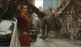  ?? ?? Shazam (Zachary Levi) gives directions in “Shazam! Fury of the Gods,’’ the sequel that topped a weak box office with $30.5 million in U.S. and Canadian theater receipts.