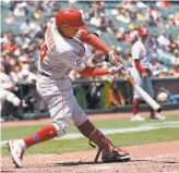  ?? Jeff Chiu / Associated Press ?? The Phillies’ Ronald Torreyes hits a tworun double against the Giants during the third inning. Torreyes also homered.