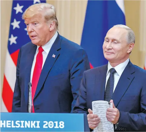  ?? YURI KADOBNOV / AFP / GETTY IMAGES ?? U.S. President Donald Trump and Russia President Vladimir Putin arrive for a press conference Monday in Helsinki.