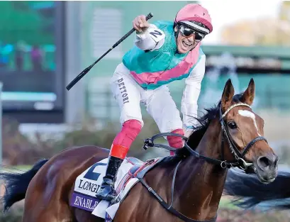  ??  ?? BRILLIANT. Jockey Frankie Dettori reacts as Enable crosses the line first at the Breeders Cup Turf at Churchill Downs on Saturday.