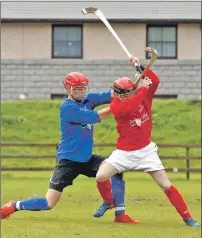  ?? Photograph: Stephen Lawson ?? Oban Camanachd’s Lewis Buchanan, in red, and Kingussie’s Alexander Michie during the North v South Under 17 match.