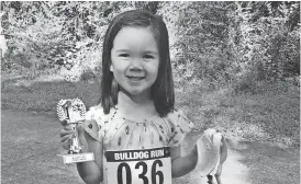  ??  ?? The Cedartown Bulldogs cross country team took over a portion of the Silver Comet Trail on Aug. 5 for a benefit run for their team. Winners of the Bulldog Run were Tommy Reilly with a time of 26:51, and Sandi Smith for the overall female winner. Ruby...