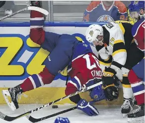  ?? ED KAISER ?? Connor McDonald of the Oil Kings, left, hits the ice courtesy of Brandon’s Gunnar Wegleitner Friday at Rogers Place.