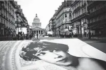  ?? Christophe Ena / Associated Press ?? Pictures of Josephine Baker and a red carpet lead to the Pantheon monument in Paris where she was inducted Tuesday.