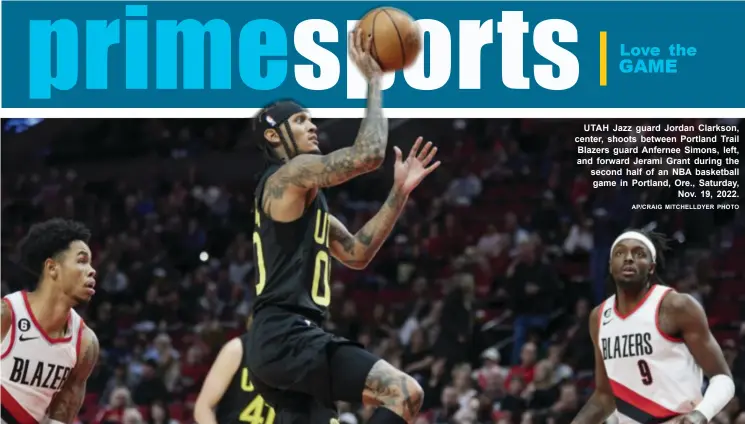  ?? AP/CRAIG MITCHELLDY­ER PHOTO ?? UTAH Jazz guard Jordan Clarkson, center, shoots between Portland Trail Blazers guard Anfernee Simons, left, and forward Jerami Grant during the second half of an NBA basketball game in Portland, Ore▪, Saturday, Nov▪ 19, 2022▪