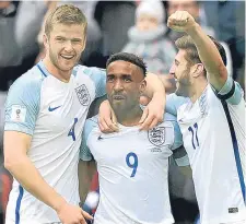 ??  ?? Jermain Defoe (centre) celebrates scoring for England.