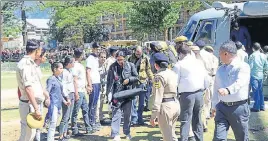  ?? HT PHOTOS ?? Tourists land in Kullu after they were rescued by the IAF from Himachal’s Lahaul and Spiti district; (and below) many vehicles were damaged in a flash flood after a cloudburst at Kotkhai in Shimla on Wednesday.