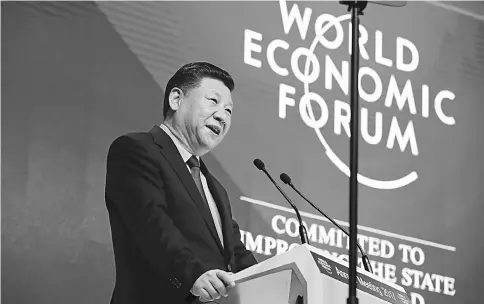  ??  ?? Chinese President Xi speaks during the opening plenary session of the World Economic Forum (WEF) annual meeting in Davos, Switzerlan­d, on Jan 17. — WP-Bloomberg photo