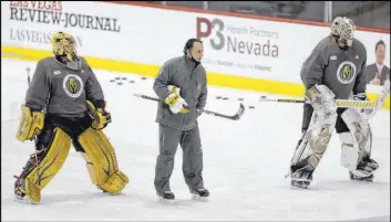  ?? K.M. Cannon Las Vegas Review-Journal @KMCannonPh­oto ?? Goaltendin­g coach Mike Rosati works with Marc-Andre Fleury, left, and Robin Lehner during a practice at City National Arena.