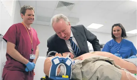  ?? Picture: PA. ?? Alex Neil during a visit to Forth Valley Royal Hospital in 2013 when he was health secretary, alongside Dr Stephen Hickey and Dr Donna Fraser.