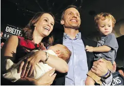  ?? J. B. FORBES / ST. LOUIS POST- DISPATCH VIA THE ASSOCIATED PRESS ?? Eric Greitens, with wife Sheena and their two sons, reacts after winning the Republican governor primaries in Missouri in 2016. Greitens has admitted to an affair.