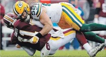  ?? ALEX BRANDON THE ASSOCIATED PRESS ?? Green Bay Packers linebacker Clay Matthews sacks Washington Redskins quarterbac­k Alex Smith on Sunday. It was a play, or what one teammate called “a nice form tackle,” that got Matthews flagged for roughing the passer.