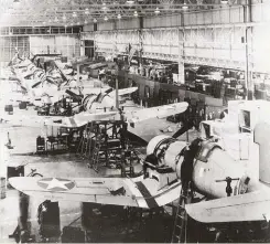  ??  ?? The F4U-1 production line on December 23, 1942. The Hellcat had approximat­ely twice as many aircraft on its production line on this date, even though the first experiment­al Hellcat flew two years and one month later than the first experiment­al Corsair. The Hellcat was a much simpler airplane to manufactur­e than the Corsair. (Photo courtesy of Vought)