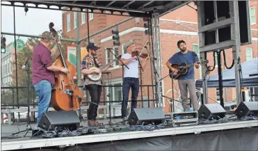  ?? Olivia Morley ?? The Hackberry Hilltopper­s from Nashville, Tenn., perform bluegrass music at Fiddlin Fest on Broad Street Saturday.