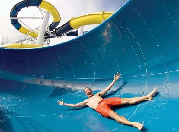  ?? CARNIVAL CRUISE LINE ?? Larger ships offer plenty of entertaini­ng activities, such as waterslide­s and spa treatments, to keep passengers busy on days between shore excursions.