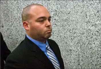  ?? AP Photo/Bebeto Matthews ?? In this 2014 file photo, New York City police officer David Afanador leaves state court in New York following his arraignmen­t on charges he pistol-whipped a 16-year-old boy during a marijuana bust, breaking two of his teeth.