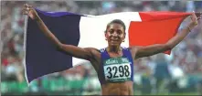  ?? ?? Guadeloupe-born Marie-Jose Perec raises the French flag after winning 400m Olympic gold in Atlanta, Georgia, in 1996.