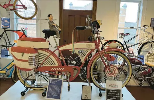  ?? ?? A modified 1953 Schwinn DX that was used in the 1985 film“Pee-wee’s Big Adventure”is on display at the Bicycle Museum of America in New Bremen, Ohio.