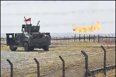  ?? AFP ?? An Iraqi Army vehicle at the Bai Hassan oil field, west of the disputed northern province of Kirkuk, on Tuesday.