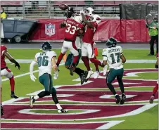  ?? ROSS D. FRANKLIN — THE ASSOCIATED PRESS ?? Arizona Cardinals cornerback Byron Murphy (33), free safety Chris Banjo, right, break up the Eagles’ final pass attempt with no time on the clock during the second half.